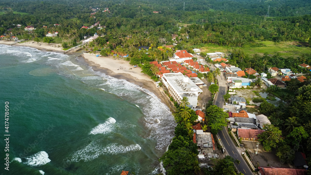 Aerial view of Karang Bolong Beach and Its Wonderful Sunset View. At anyer beach with noise cloud and cityscape.