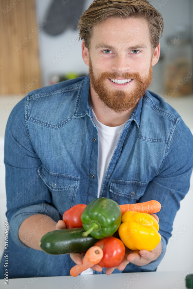 Fototapeta premium happy man with vegetables in hands