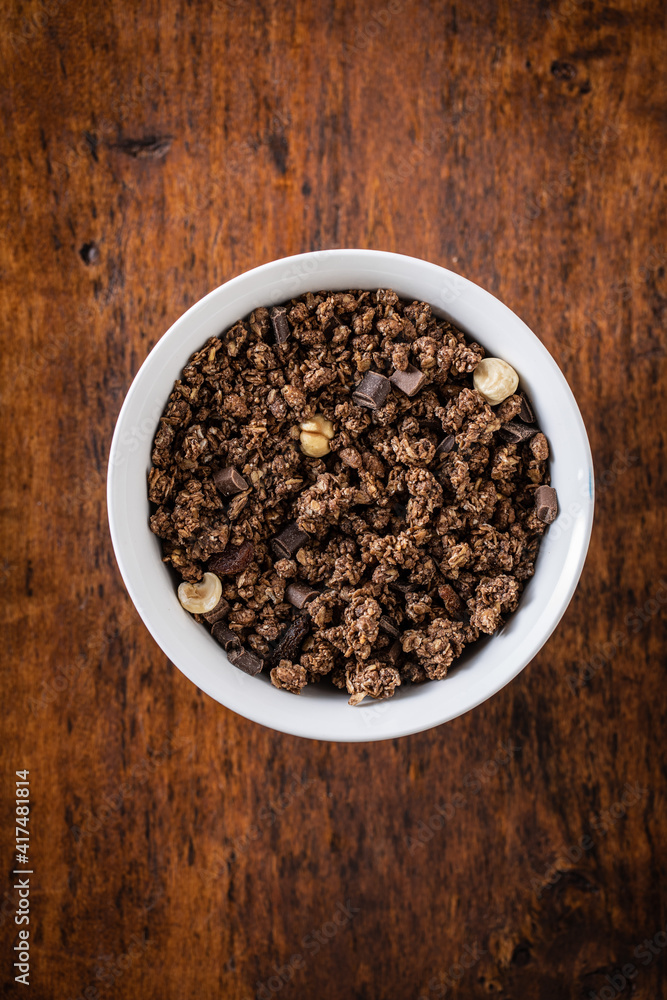 Chocolate breakfast cereal. Morning granola in bowl Chocolate breakfast cereal. Morning granola in bowl