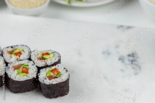 Wallpaper Mural Sushi rolls prepared by professional asian chef with traditional Japanese ingredients. Salmon, rice, vegetables, sesame seeds.  Torontodigital.ca