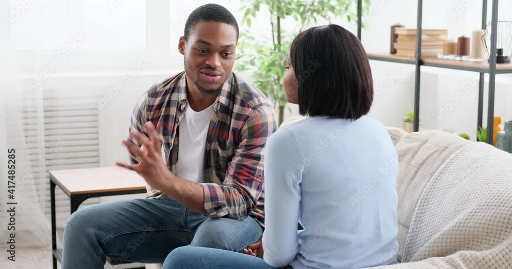 Man proposing woman with a ring and embracing at home Man proposing woman with a ring and embracing at home