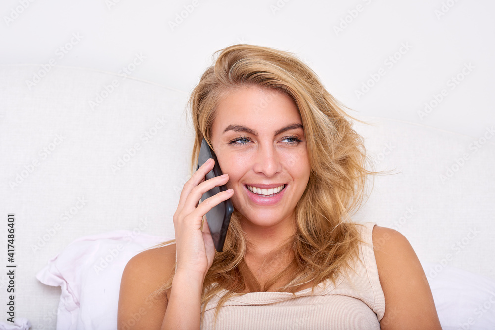 On phone in bed On phone in bed