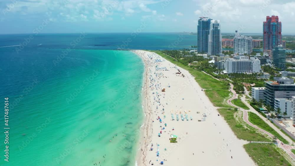 The best beaches in world. Top view waterfront resorts in Miami beach. Hotels on shore of blue sea. Miami, Florida, USA. White sand, beautiful beach, green park. Turquoise sea water, summer vacation The best beaches in world. Top view waterfront resorts in Miami beach. Hotels on shore of blue sea. Miami, Florida, USA. White sand, beautiful beach, green park. Turquoise sea water, summer vacation