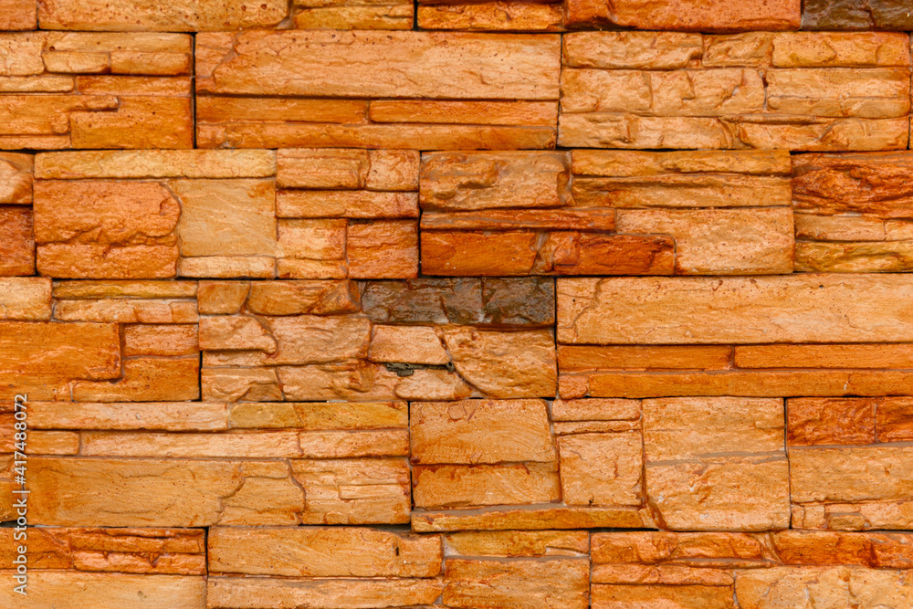 Orange stone wall used in home decoration Orange stone wall used in home decoration