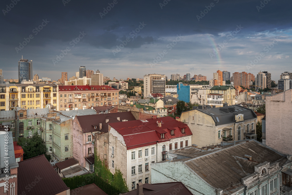 Aerial view of Kyiv buildings with a rainbow on background - Kiev, Ukraine