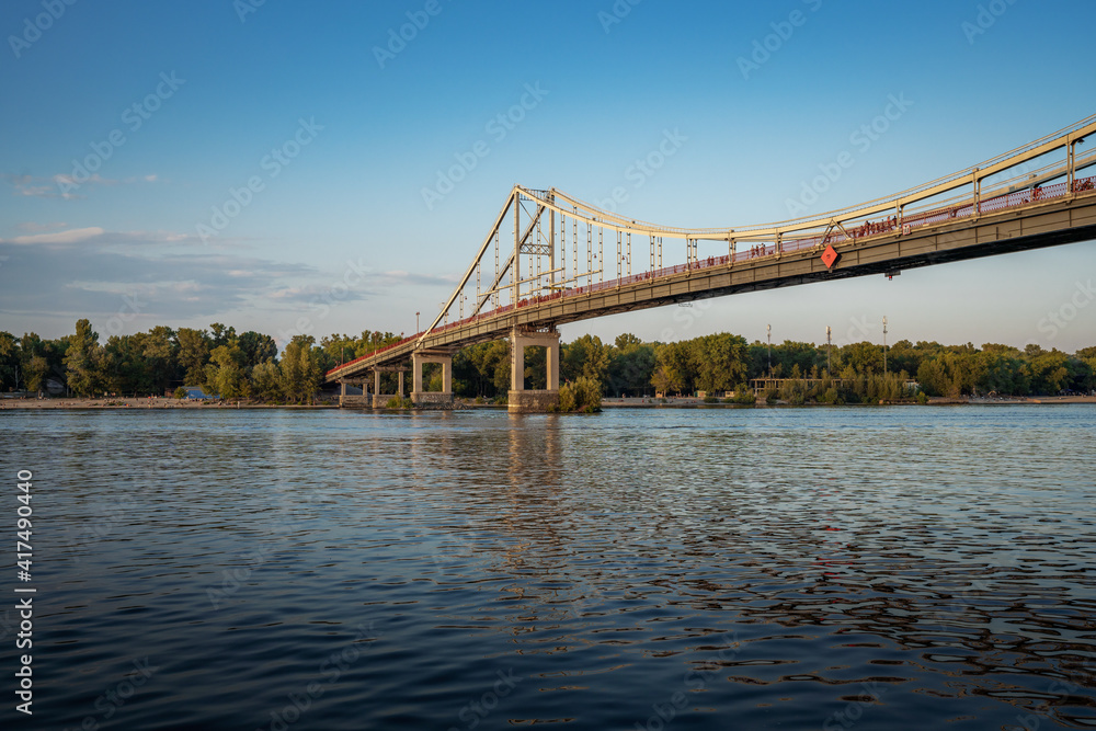 Dnieper River and Parkovy pedestrian bridge - Kiev, Ukraine Dnieper River and Parkovy pedestrian bridge - Kiev, Ukraine
