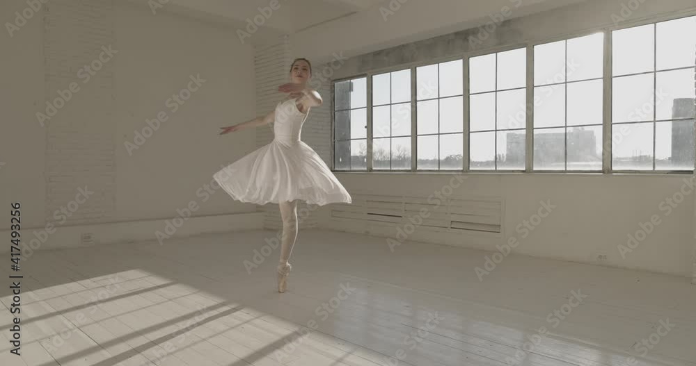 Young caucasian ballet dancer performing in studio. Choreographer spinning around herself, training before going on stage. Arts concept 4k footage Young caucasian ballet dancer performing in studio. Choreographer spinning around herself, training before going on stage. Arts concept 4k footage