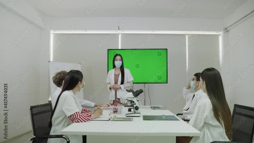 At the doctor's meeting, the young woman's doctor was presenting her medical information on a green screen.
At the doctor's meeting, the young woman's doctor was presenting her medical information on a green screen.