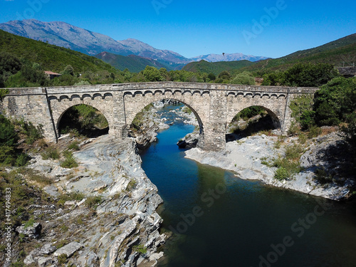 Old bridge with path in the mountains of Corsica France