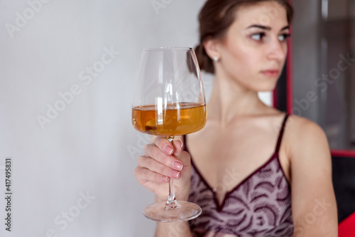woman enjoying glass of white wine