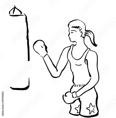 Woman kickboxer training.
Woman kickboxer hitting punching bag while dust particles flies.