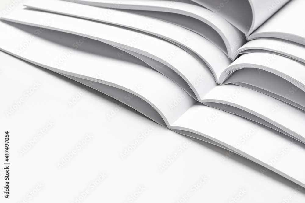 Open blank magazines on white background Open blank magazines on white background