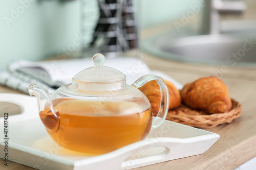 Glass teapot with hot herba...
