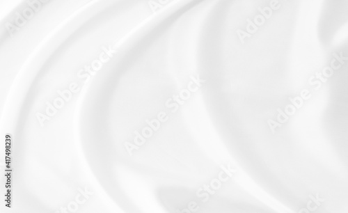 White gray satin texture that is white silver fabric silk background with beautiful soft blur pattern natural.