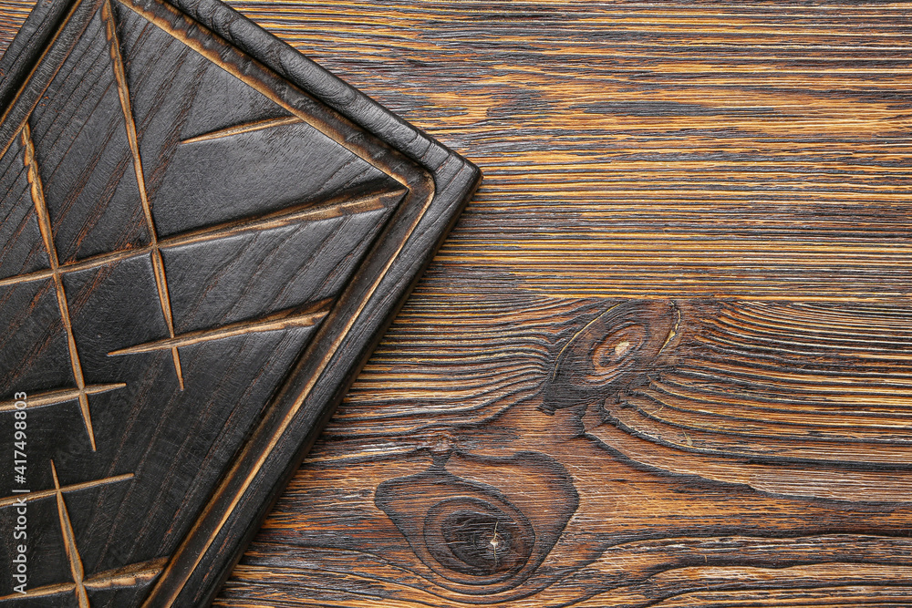 Cutting board on wooden background Cutting board on wooden background
