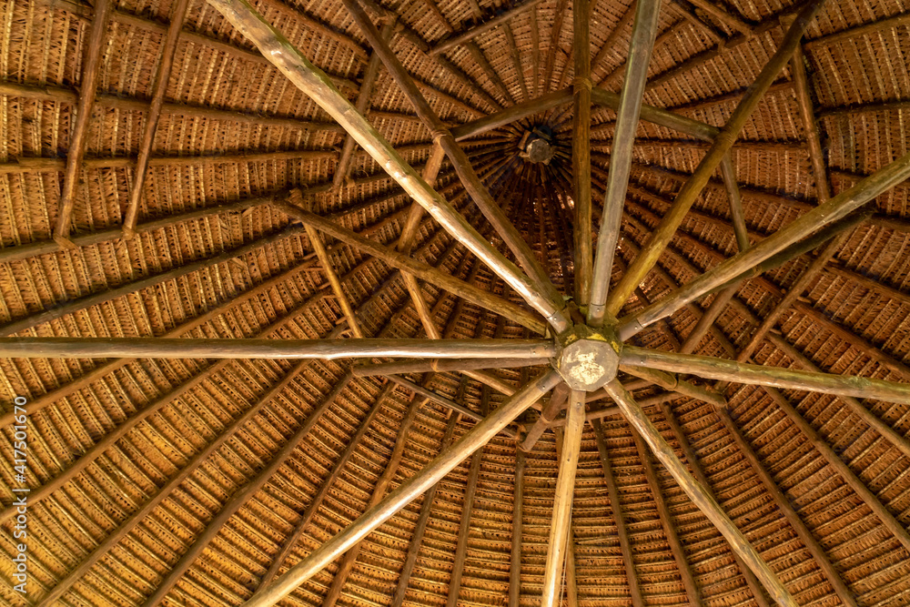 Nauta, Peru. Looking up at a circular plaited palm thatched roof interior.