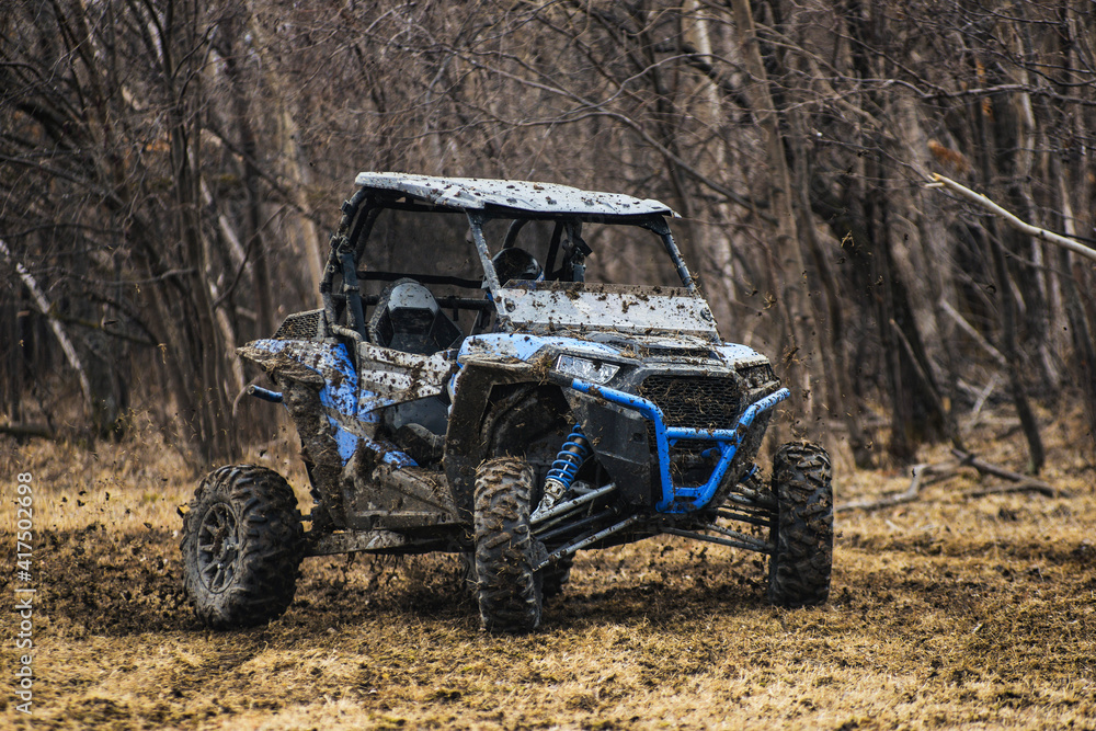 ATV adventure. Buggy extreme ride on dirt track. UTV Photos | Adobe Stock