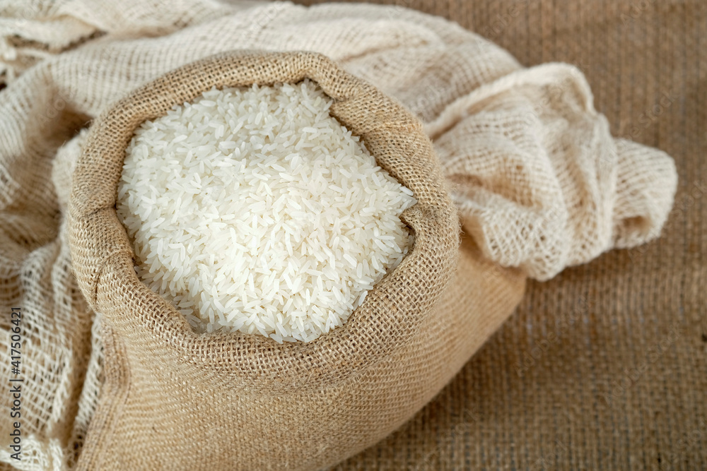 Thai jasmine rice in in burlap sack. Thai jasmine rice in in burlap sack.