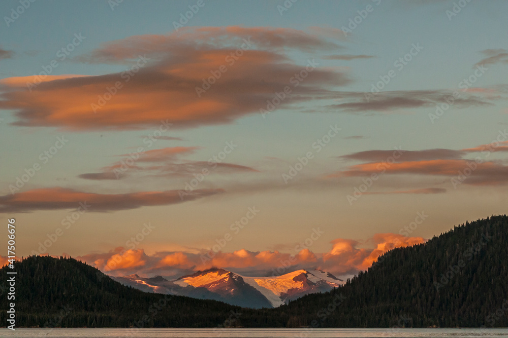 USA, Alaska, Tongass National Forest. Sumdum Glacier on mountain at sunset.