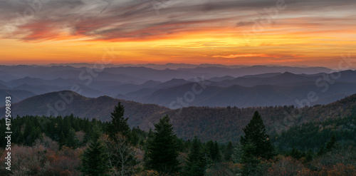 Colorful setting autumn sun on the southern stretch of Blue Ridge Parkway - North Carolina Cowee Mountain Overlook