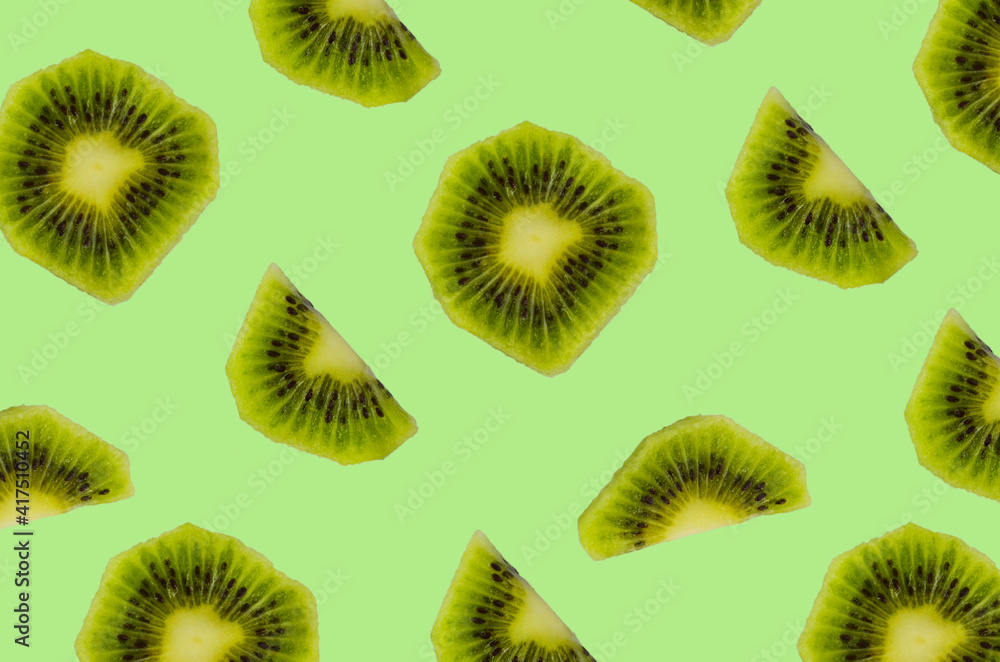Fototapeta premium seamless regular pattern or background with kiwi fruit, levitation food