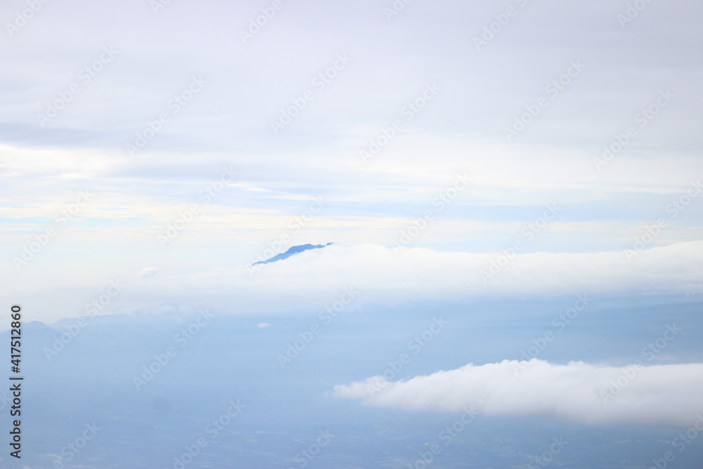 Fototapeta premium airplane flying over the clouds