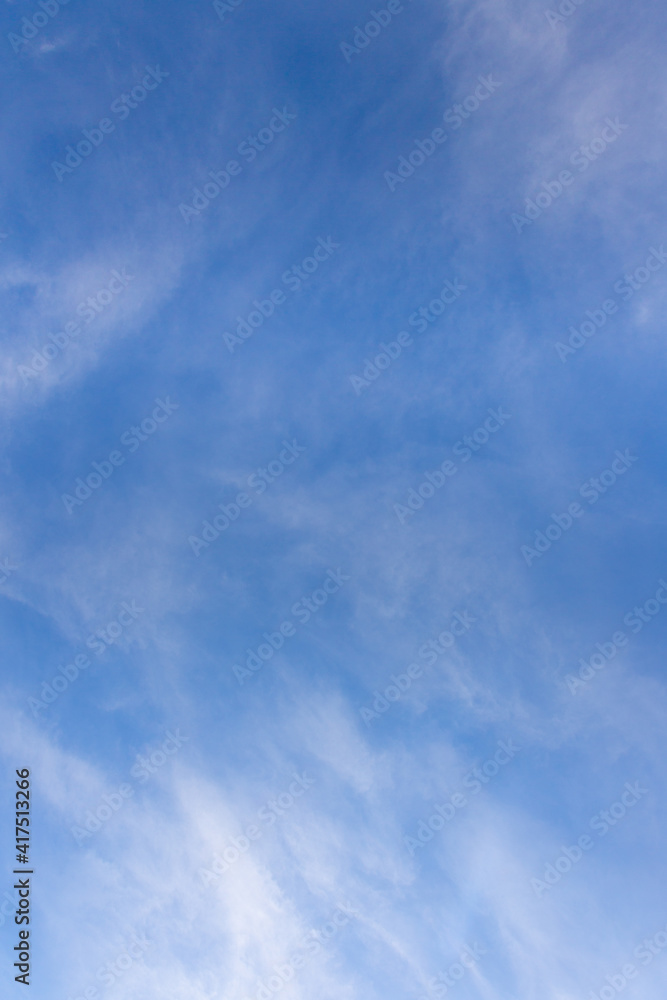 The sky on a sunny day with clouds. vertical direction background. The sky on a sunny day with clouds. vertical direction background.