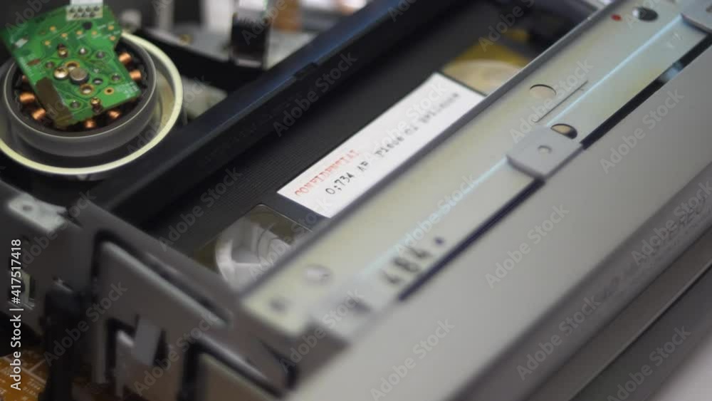 Close-up of video cassettes inside VHS video recorder Close-up of video cassettes inside VHS video recorder