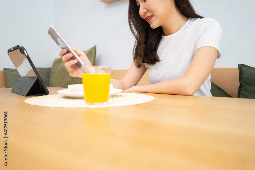 life style Morning women have breakfast sandwiches orange juice life style Morning women have breakfast sandwiches orange juice