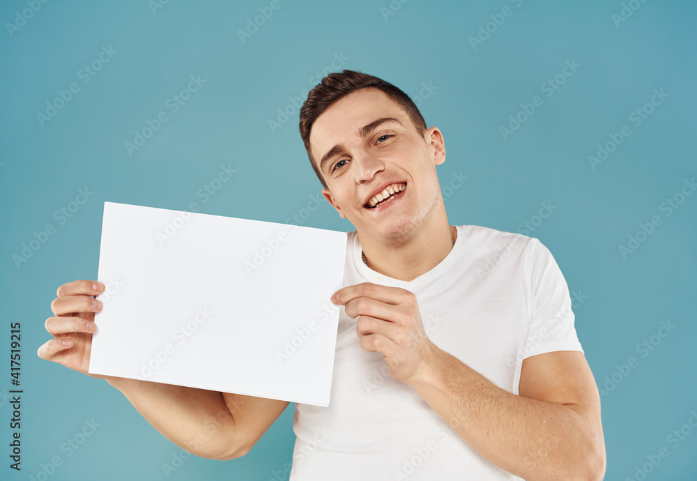 Guy with a white sheet of paper blue background advertising mocap poster Guy with a white sheet of paper blue background advertising mocap poster