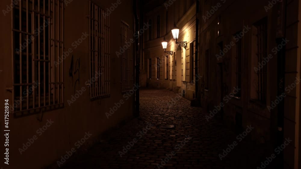 street between a building and in the background. Prague night 2021 street between a building and in the background. Prague night 2021