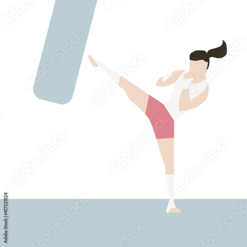 Female kick boxer keeping healthy and practicing on a punching bag