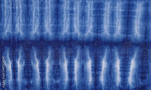 blue background cotton tie dye pattern textured design.   surface material denim cloth close up canvas jeans wallpaper suitable for any project
