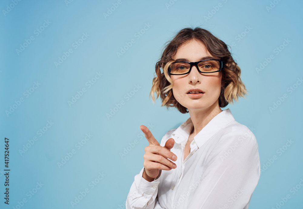 Fashionable woman in glasses and blue background white shirt Copy Space Fashionable woman in glasses and blue background white shirt Copy Space