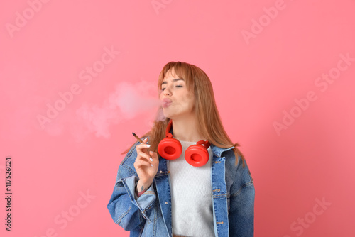Young woman smoking cigaret...