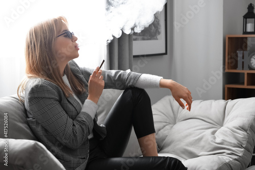 Young woman smoking cigaret...