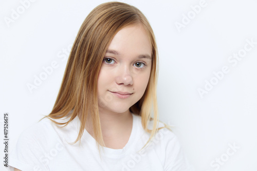 cute smiling girl in white t-shirt close up isolated background