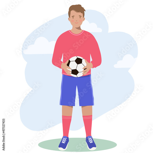 Sport. Football Player holds a soccer ball in his hands.