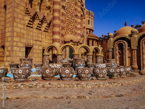 Sharm El Sheikh, Egypt - January 17, 2020: Group of decorative vases on the square near the wall of the Al Sahaba Mosque in Sharm El Sheikh. Architecture decor with many mosaic flowerpots, outdoors photo