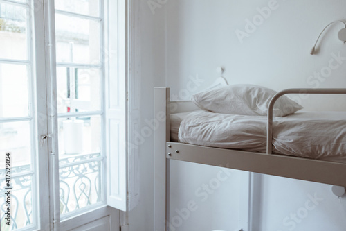 Tableau sur toile white bunk bed near window in white room