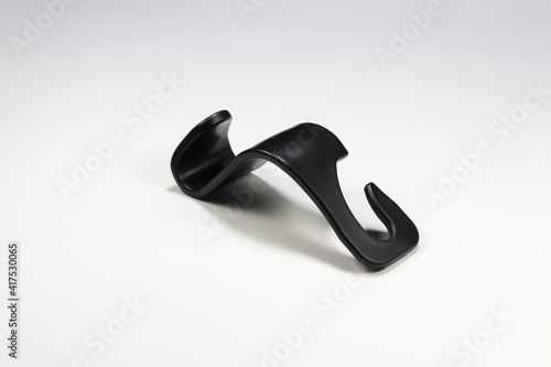 Creative plastic hook isolated on the white background. 