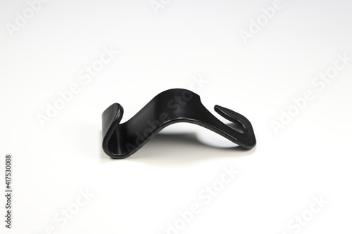 Creative plastic hook isolated on the white background. 