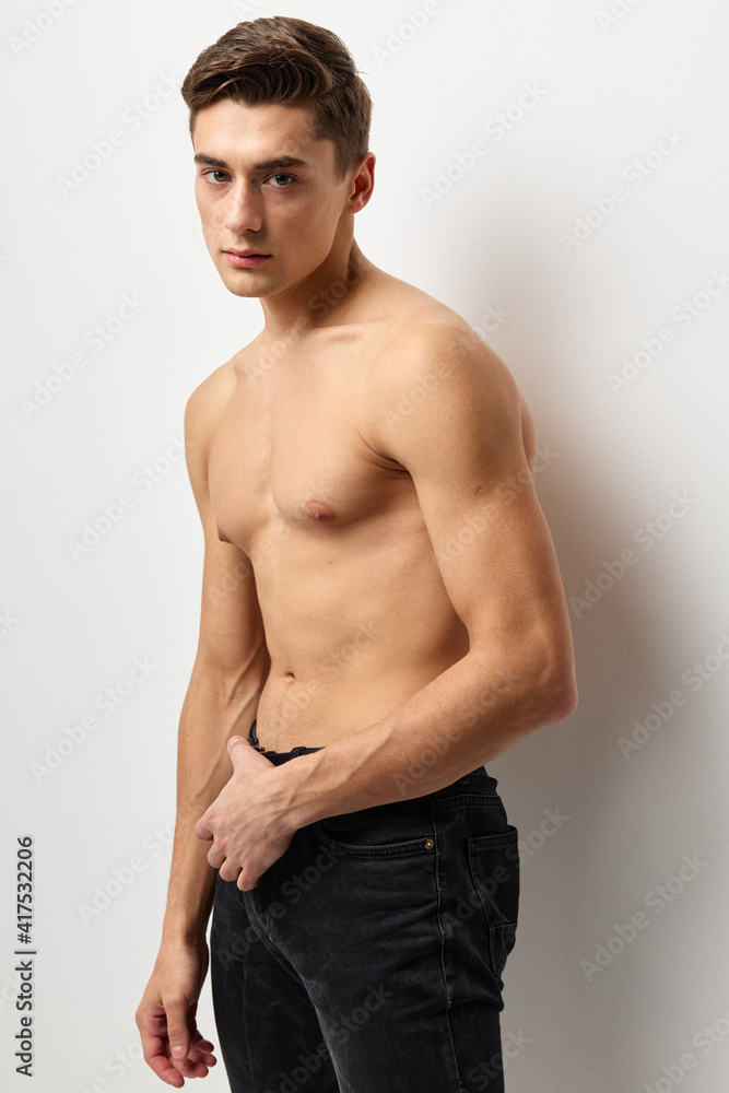 handsome man fashion hairstyle nude torso cropped view studio posing