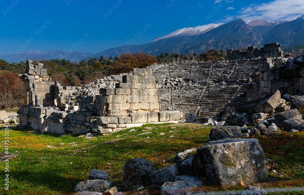 Remains of Roman theatre in ancient ruined Lycian citadel of Tlos on sunny winter day, Mugla Province, Turkey