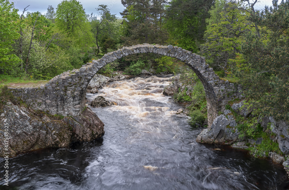 The old packhorse bridge in Carrbridge in the Cairngorms National Park ...