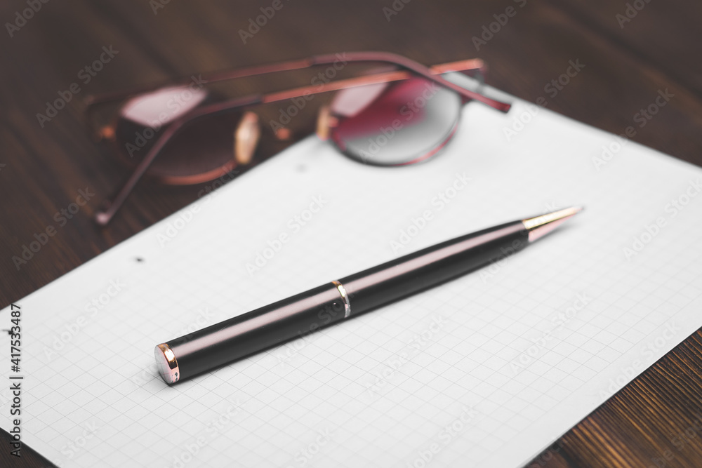 notebook and pen on a wooden table coffee cup flower in a pot top view notebook and pen on a wooden table coffee cup flower in a pot top view