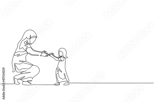 One continuous line drawing of young Islamic toddler daughter learn to walk while mom ready to catch. Happy Arabian muslim parenting family concept. Dynamic single line draw design vector illustration