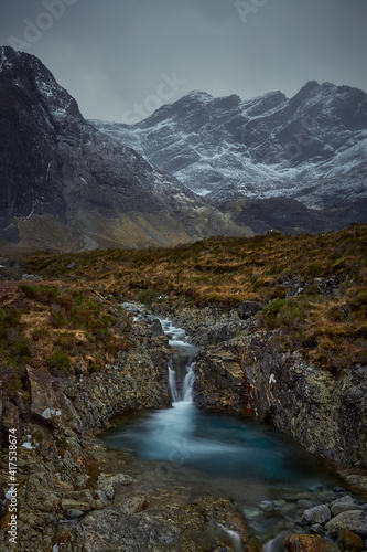 mountainous valley with river, waterfall and lake. concept of nature, freedom, tourism, trekking - Fairy Pools - Skye Island - Scotland - Uk