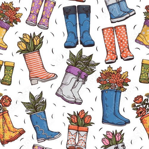 Colorful seamless pattern with wellies rubber boots, spring and autumn bouquets.
