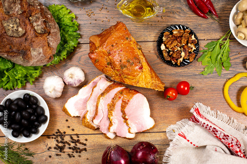 Assortment of cold cuts, a variety of processed cold meat products. On a wooden background